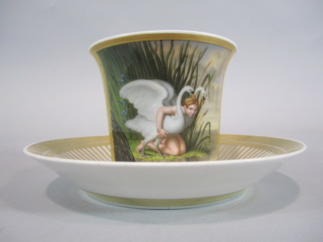 H63-12 ROYAL VIENNA CUP & SAUCER: Cup has been damaged. Cup measures 4" tall and saucer 6 1/4" diameter. Estimate $200 - $400 Starting Bid $100