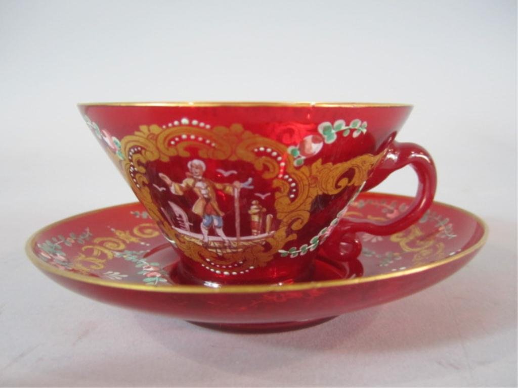 H70-8 FRENCH ART GLASS CUP & SAUCER: With Royalty portrait with staff. Cup measures 1 3/4" tall and saucer 4 3/8" diameter. Estimate $200 - $400 Starting Bid $50