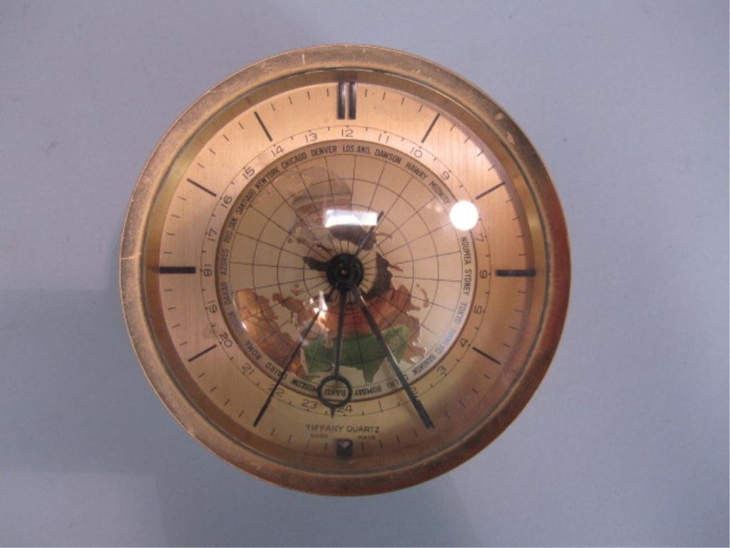 A11-40 TIFFANY QUARTZ CLOCK: Measures 2 1/4" tall x 4 1/4" diameter. Estimate $100 - $300 Starting Bid $50