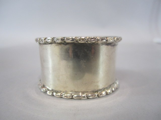 H87-18 STERLING SILVER NAPKIN RING: Total weight 10.5 troy ounces. Measures 1 1/2" diameter. Good condition. Estimate $100 - $200 Starting Bid $50 **ALL PROCEEDS WILL BE DONATED TO UCLA FOR EPILEPSY RESEARCH IN MEMORY OF DR. ALFONSINA "