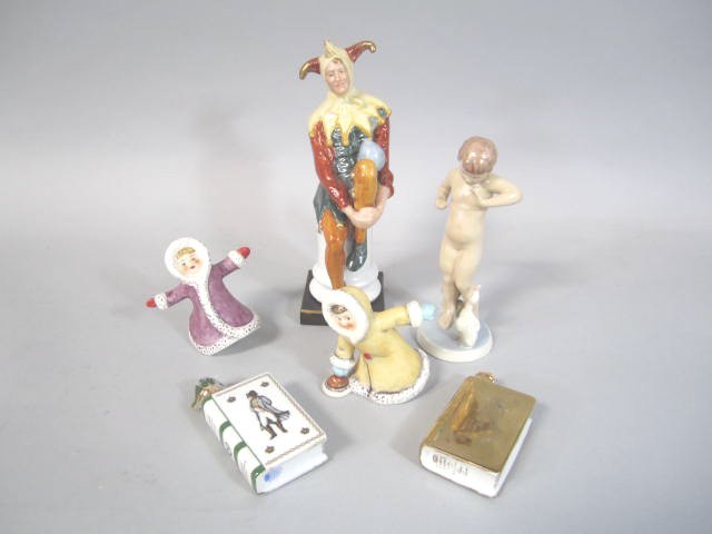 J3-7 GROUP OF 6 FIGURINES: Including Daulton Jester (1900-1935), Royal Dux man with duck, two Goebel skaters, and two Limoges flasks. Largest measures 10" tall. Good condition. Estimate $100 - $300 Starting Bid $20