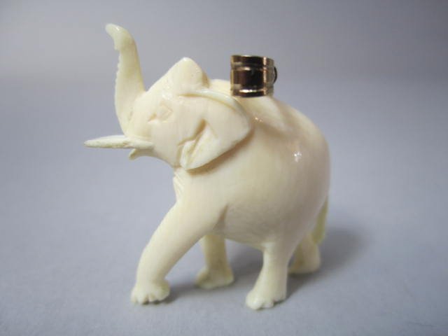 H44-2 TWO CARVED IVORY PENDANTS - 2