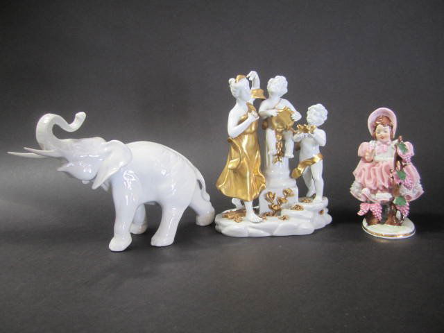 A3-10 Group of Three Porcelain Figurines: Including Royal Dux elephant, Capodimonte figurine, and Dresden figurine. Largest measures 7 1/2" tall. Good condition. Estimate $200 - $300 Starting Bid $20