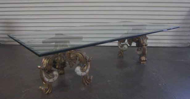 A3-2 Beveled Glass Top Coffee Table: 3/4" thick beveled glass on two carved wood bases. Measures 18 1/4" tall x 71 3/4" wide x 36" across. Good condition. Estimate $400 - $700 Starting Bid $50
