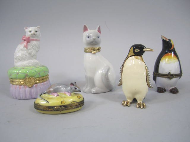 A77-41 Group of 5 French Limoges Boxes: Including two cats, two penguins, and mouse. Largest measures 4" tall. Good condition. Estimate $50 - $200 Starting Bid $10