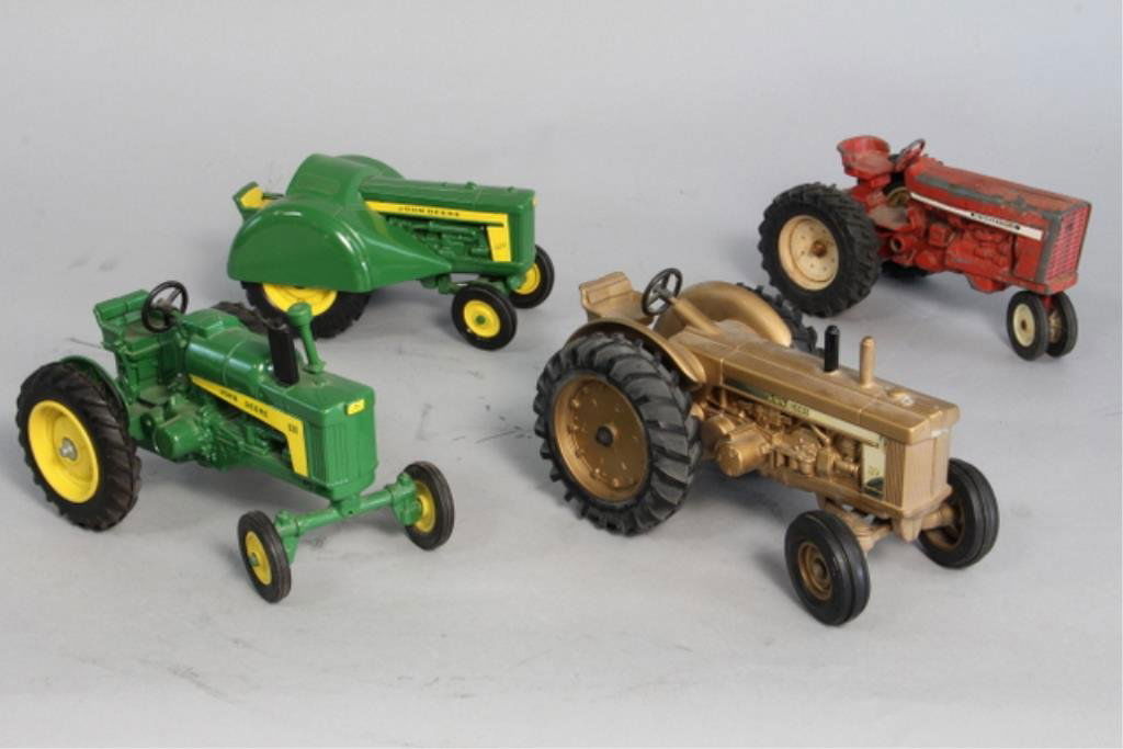 A89-2 Vintage John Deere & International Tractors: Largest measures 9" long. Original condition. Estimate $300 - $400 Starting Bid $50