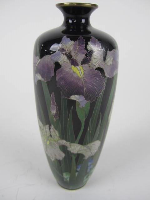 ANTIQUE JAPANESE CLOISONNE VASE.: Lillies. Hallmarked on bottom. Very small repair on top, see picture. Measures 7 1/2" Tall. Estimate $200- 300. Starting Bid $150.