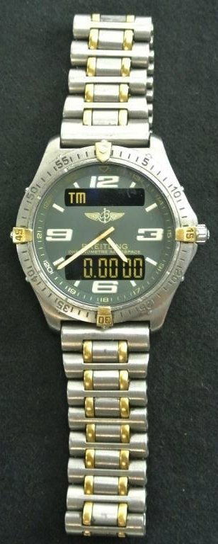 BREITLING 18K & TITANIUM AERO SPACE WATCH: Estimate $1,200- 1,500. Starting Bid $1,000.
