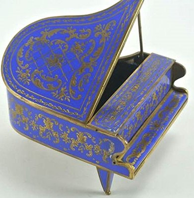 BH16 FRENCH ENAMEL PIANO MUSIC BOX: Missing piece on bottom, pedals have been repaired.. Measures 2 3/4 tall x 5 3/4 long x 4" wide. Estimate $400- 600. Starting Bid $10.