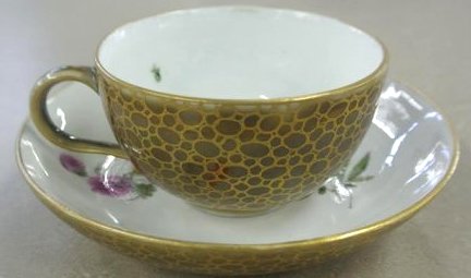 BH46 18TH CENTURY MEISSEN CUP AND SAUCER: Saucer measures 5" diameter and cup is 1 3/4" tall. Estimate $600- 800. Starting Bid