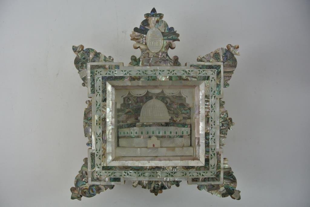ANTIQUE MOTHER OF PEARL SHADOW BOX: Inlaid with pierced and carved mother of pearl, under glass. Measures 13 1/2" x 11 1/4". Starting Bid $10.