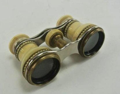 FRENCH 19TH CENTURY IVORY OPERA GLASSES: Fine late 19th century ivory opera glasses, made in France (likely Paris). The turned and carved ivory parts are held by gilt mounts, with a carved ivory beaded pattern. Measures 4" long x 2 1/4" high