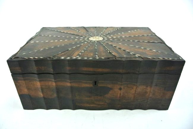 ANGLO INDIAN COROMANDEL WORK BOX W/ 24 COMPARTMENTS: A fine Anglo Indian work box made from Coromandel wood inlaid with ivory and ebony (19th century, Ceylon district). 24 compartments inside, with sunburst design and scalloped edges. Has some issues (s