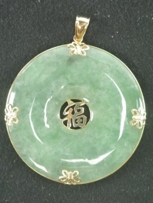 ANTIQUE CHINESE JADE GOOD LUCK PENDANT: Set in 14K yellow gold. Estimate $650- 750. Starting Bid $225.