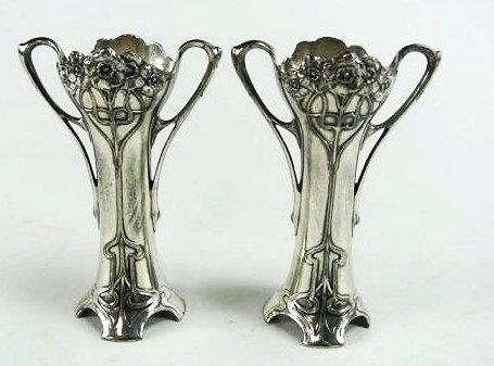 H25-41 PAIR OF WMF ART NOUVEAU VASE SLEEVES: They are from the Art Nouveau period for sure.THE HALLMARKS ARE B = Britannia-metal OX = oxidized. WMF is a German company founded in 1853. There is quite the history about it.Measures 5 1/2" tall. Es