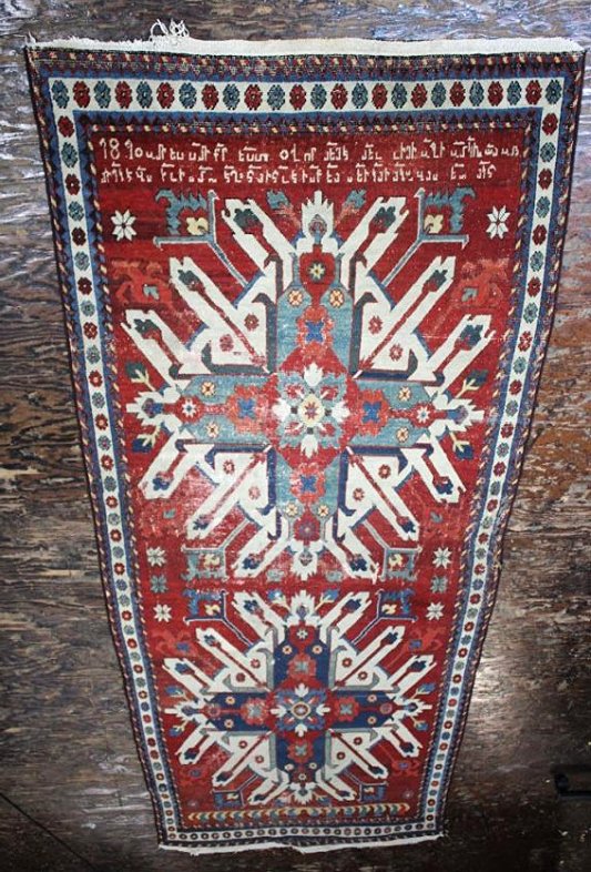 J90-31 RUSSIAN / ARMENIAN RUG DATED 1870: Has some wear. Estimate $3,000 - $4,000 Starting Bid $1,000We are told this rug was made in Russia and has Armenian writing. Its dated 1870. If this description is not correct then let me know.