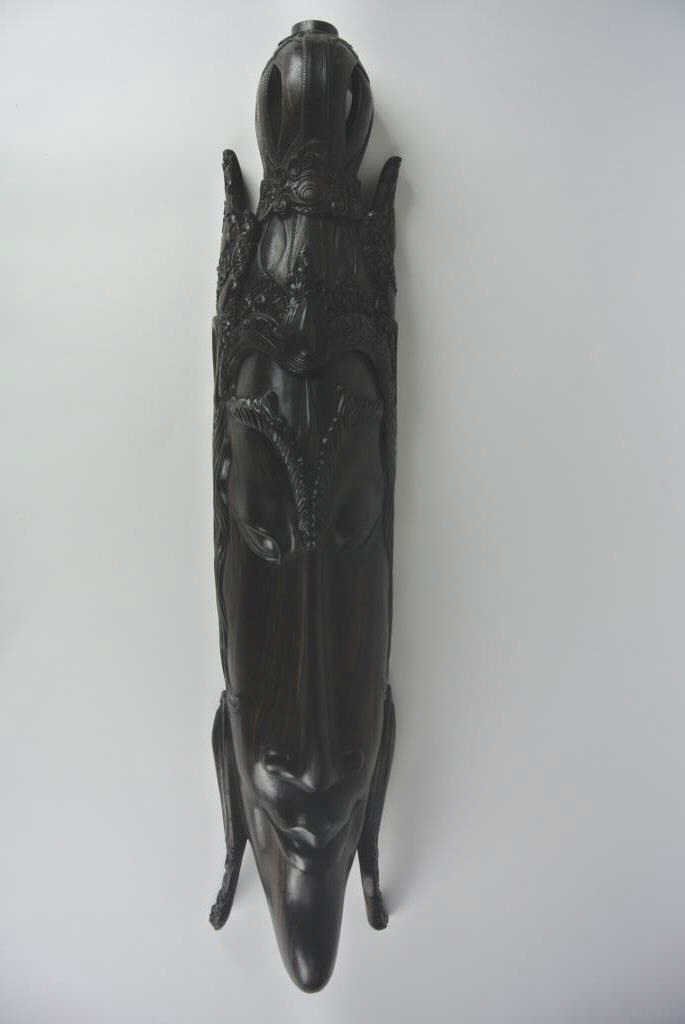 J78-11 EBONY PRIEST MASK: Measures 32 1/2" long. Estimate $100- 200. Starting Bid $50.