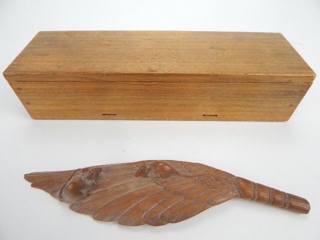 K11-57 JAPANESE CARVED WOODEN OKIMONO: Small oriental carving in shape of birds feathers tied together to form small broom for sweeping charcoal from the hearth. On the carved wood feather are two small rodents on a leaf. Signed with chop 