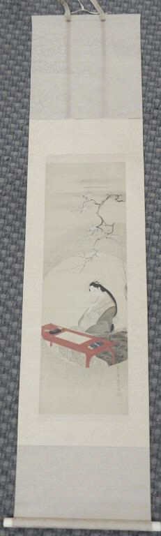 K11-200 ORIENTAL PAINT ON SILK SCROLL: Attributed to Eishi, "Beauty at Desk", painting on silk of a maiden seated in front of a red table, on the table is rice paper, paint or ink tray, and water pot. The maiden is holding the brush in her