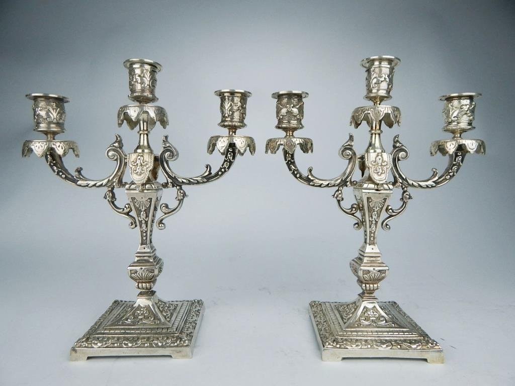 A45-55 PAIR OF TIFFANY & CO CANDELABRAS: Highly decorated silver plate, signed on bottom "Tiffany & Co." (see picture). Measures 11 1/4" x 9 1/4". Estimate $1,200 - $1,500 Starting Bid $600