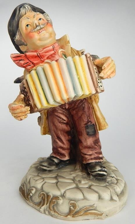 J65-112 CAPODIMONTE ACCORDION PLAYER FIGURINE: Makers mark. Measures 7". Estimate $50 - $100 Starting Bid $10