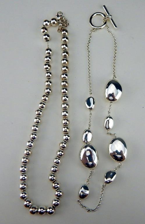 J65-79 TWO RALPH LAUREN NECKLACES: One signed and one without. Estimate $50 - $100 Starting Bid $10