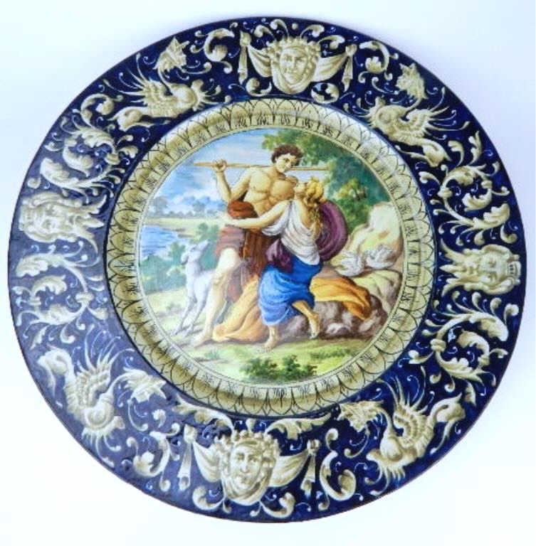 K13-9 LARGE ITALIAN ENAMELED PORCELAIN CHARGER: Hand painted and enameled porcelain with boy and girl in the center with colorful pattern on edge. Makers mark on bottom. Measures 21" diameter. Estimate $800 - $1,000 Starting Bid $540