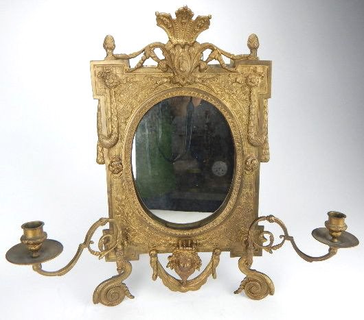 K13-34 GILT BRONZE CANDELABRA MIRROR: Wall mounted or self standing, 19th Century measuring 21" x 21". standing leg has broken hinge, and mirror has 2" hairline crack on back not seen in front. Estimate $400 - $600 Starting Bid $270