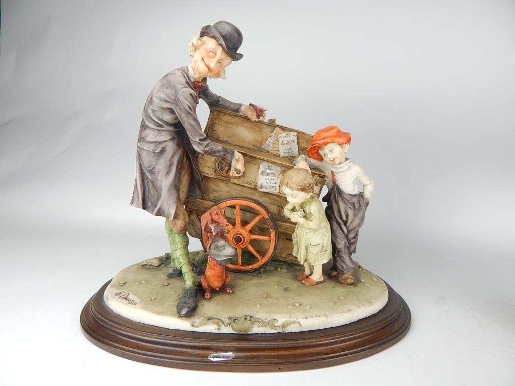 J65-6 CAPODIMONTE PUMP ORGAN PLAYER FIGURINE: Signed Armani, measuring 13" x 15". Estimate 100 - $200 Starting Bid $20