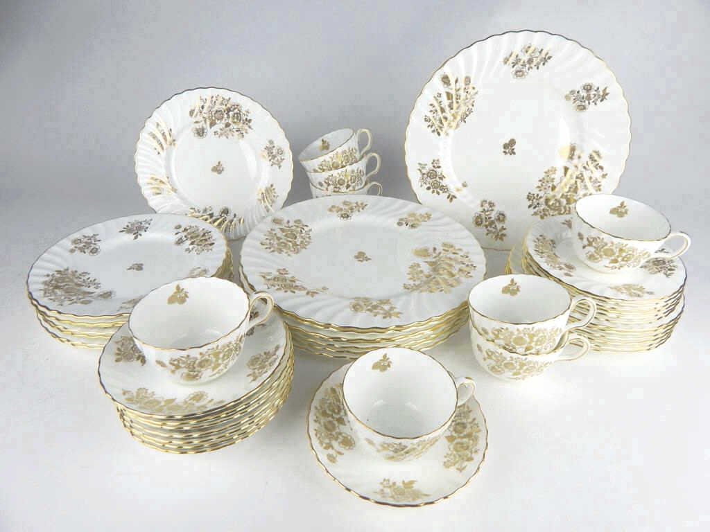 A45-48 MINTON "AUDLEY" ENGLAND BONE CHINA SET: Total of forty-three pieces of "Audley" pattern of gold flowers, swirl rim, gold trim on white English bone china. Eight dinner plates, eight salad plates, six dessert plates, five bread plates, eight