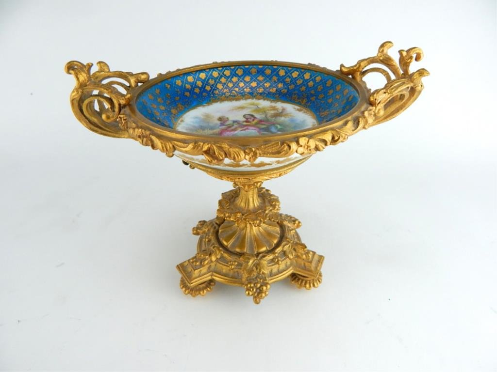 Ormolu Mounted And Sevres Porcelain Tazza: Measures 6" tall x 8" wide. Estimate $400 - $500. Starting bid $150.