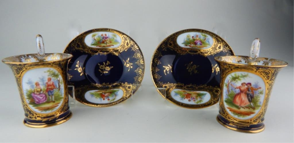 Pair of Dresden Cups and Saucers: Hand painted and gilt decorated, makers mark on both, cups measure 3 1/2" and saucer 4 1/2". Estimate $500 - $600 Starting Bid $100