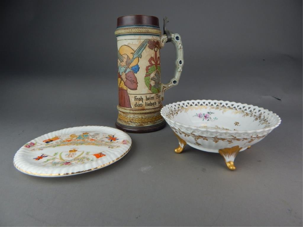 Three Pieces Miscellaneous Porcelain: Includes Stein, trivet and bowl. Tallest measures 8 1/4". Estimate $100 - $200. Starting bid $10.