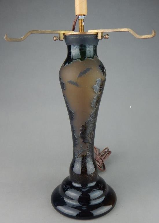 Galle Cameo Art Glass Lamp Base: Carved trees and bats does not have a shade measures 17". Estimate $300 - $500 Starting Bid $100