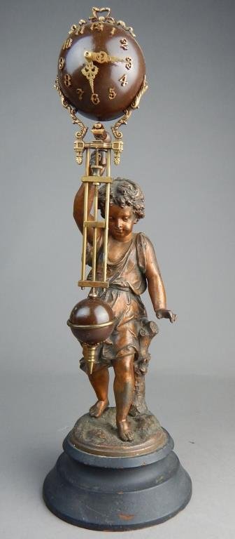 Swinger Clock with Replacement Movement Circa 1910: Measures 13 1/2" x 5". Estimate $300 - $400 Starting Bid $200