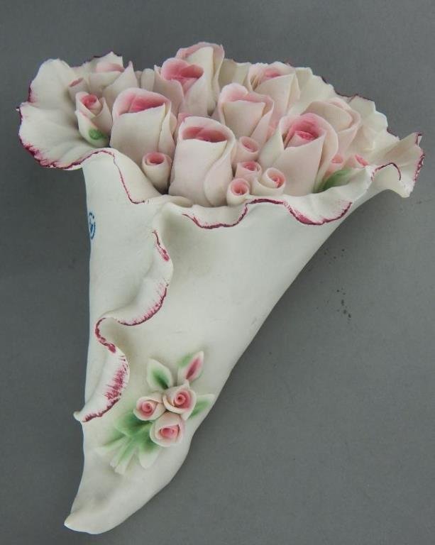 Capodimonte Porcelain Bouquet of Pink Roses: Hand painted, marked and measures 8" x 6", has small piece missing along the top. Estimate $50 - $100 Starting Bid $10