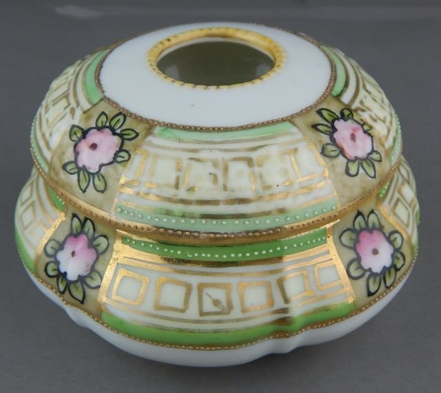 Nippon Hand Painted Porcelain Hair Receiver: Decorated with flowers and gold designs and beading, marked and measures 2 1/2" x 4 1/2". Estimate $100 - $200 Starting Bid $10