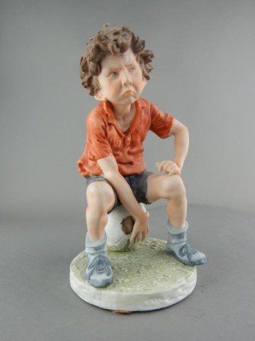 Old World Porcelain Boy Sitting on a Soccer Ball (1 of 5)