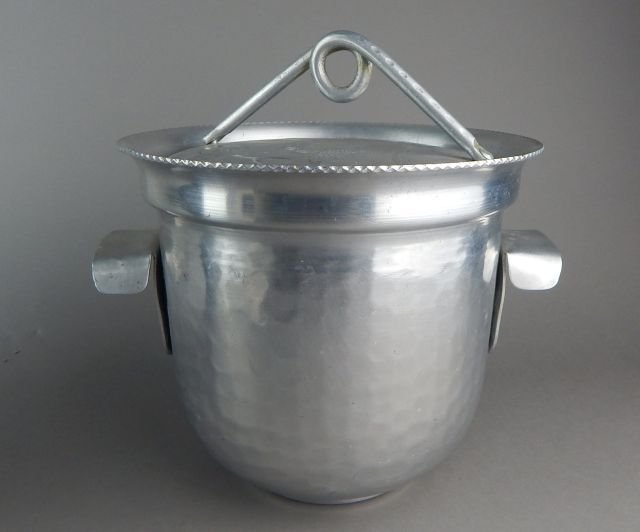 1950's Hammered Aluminum Covered Cooler: Etched bird on top and measures 9 1/2" x 10". Estimate $100 - $200 Starting Bid $20