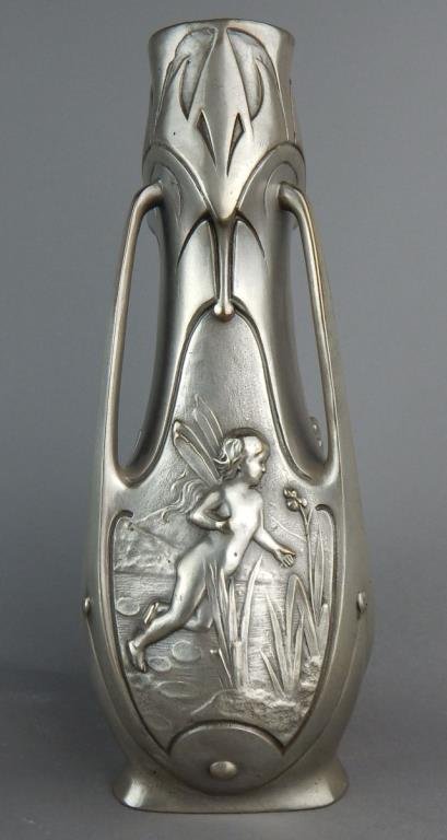 Art Nouveau Silvered Fairy Vase: Three sided double handled vase with three different fairies one on each side, signed "J. Garnier" and measures 12" x 5". Estimate $500 - $800 Starting Bid $100