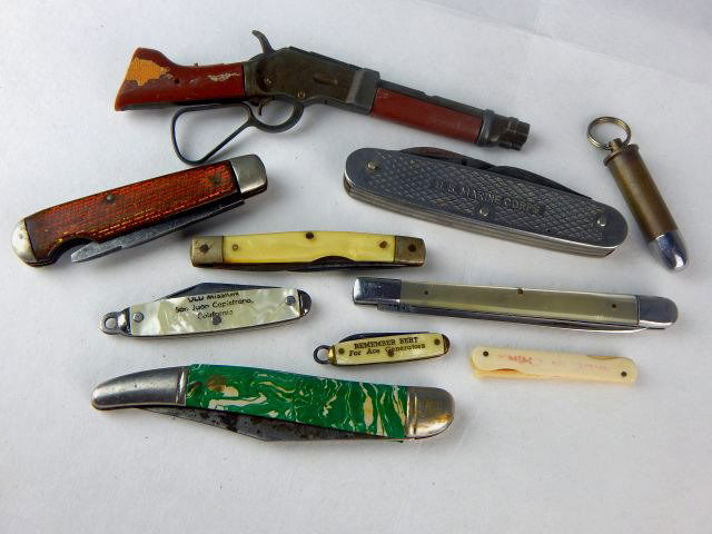 Miniature Gun, Pocket Knives & 44 Cal Shell Casing: Ten pieces in total including U.S. Marine Corp. pocket knife, .44 caliber shell casing with removable lid, mother of pearl accented, small gun 5 1/2" with foundry mark "Official Wanted Dead or Alive M
