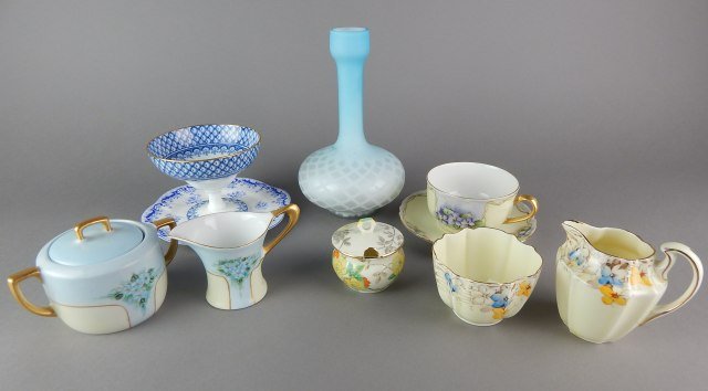 Ten English and French China Pieces: Includes cup and saucer, two creamers and sugar, one sugar, plate, bowl and vase. Tallest measures 7 1/2" tall. Estimate $50 - $100. Starting bid $20.