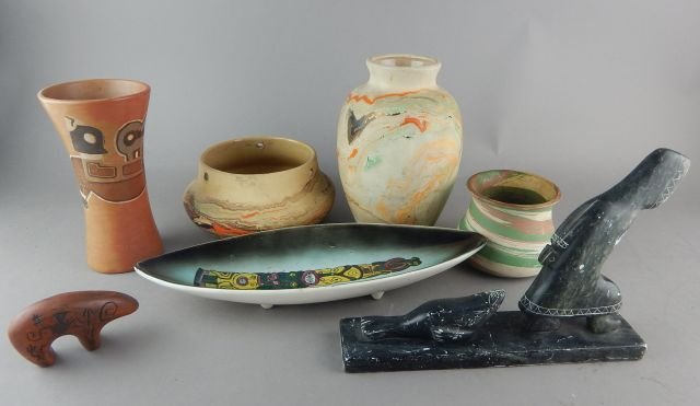 Collection of Pottery: 7 pieces. Silver Springs pottery, Nemadi pottery, Bolivian pottery, Indian pottery tray with totem Inuit eskimo bear. Tallest measures 7 ". Estimate $50 - $100 Starting Bid $30