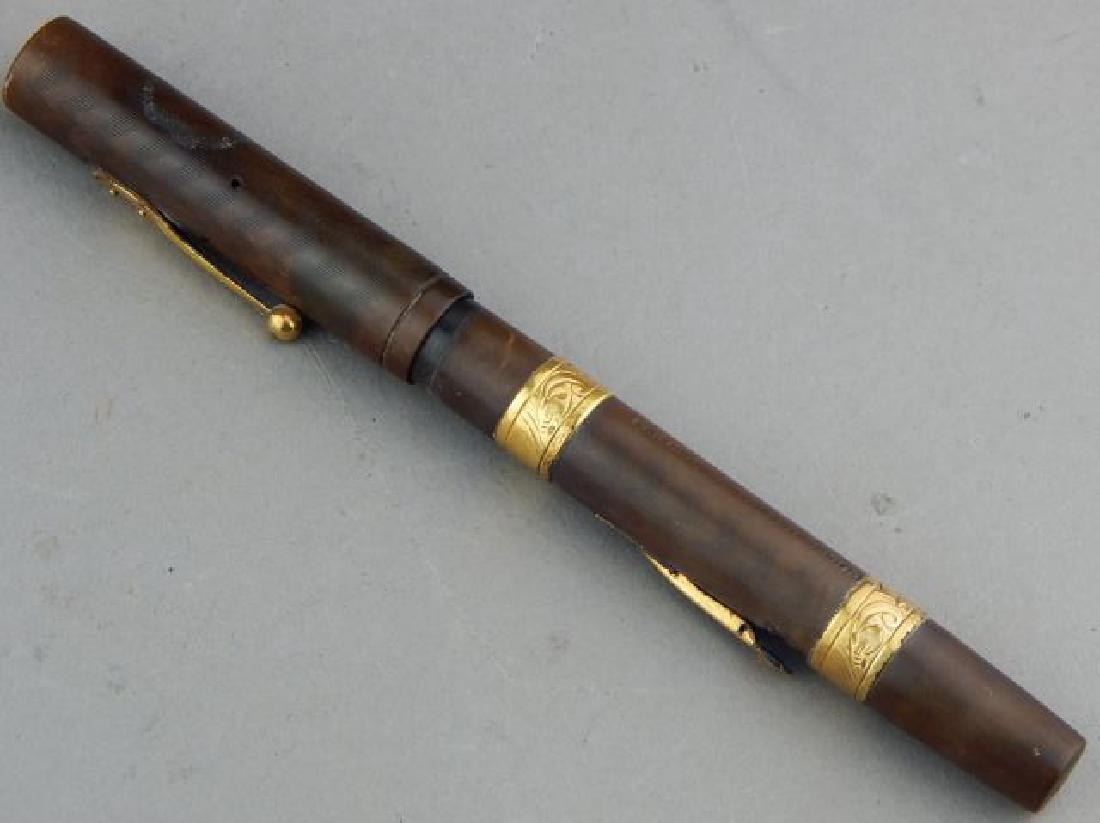 Waterman Ideal Gold Filigree Ink Pen: Marked 1908 and made of black rubber. Estimate $200 - $400 Starting Bid $80