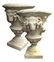 Pair of Belgian cast stone urns with rams' heads