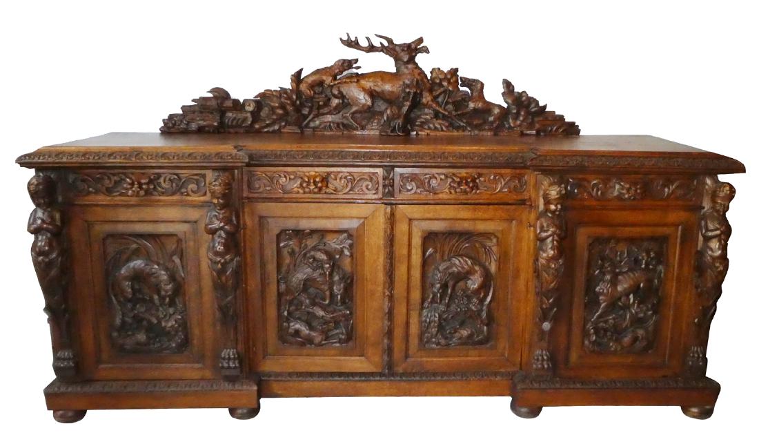French heavily carved oak sideboard with relief deer (1 of 6)