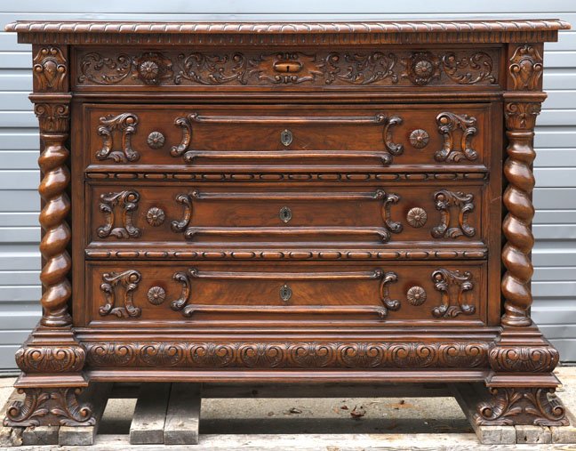 Italian Four Drawer Commode: Italian four drawer commode with barley twist columns, floral carvings, scroll work, and carved pulls. 41"H x 56"W x 23"D