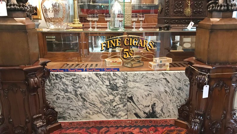 Antique American Cigar Store Counter: Antiques American cigar store counter with marble top, sliding mirrored back doors, and built in rack for the humidor. 43"H x 8'W x 16"D
