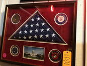 Flag that hung over the US Capitol in a shadowbox