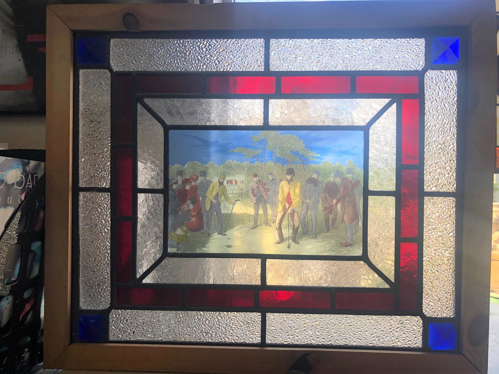 Stained glass with painted panel of late 1800s golfers: Stained glass with painted panel of late 1800s golfers. 18"h x 21.5"w